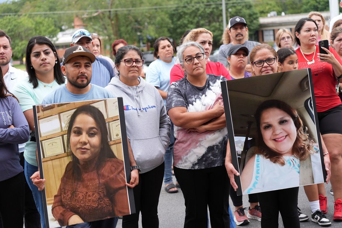 Francesco Guerrero shows a photograph of his wife, Rosa Maria Andrade Reynoso, and Guadalupe Hernandez shows a photograph of her sister, Monica Hernandez Corona, during a news conference in Erwin, Tennessee, on September 29, 2024.