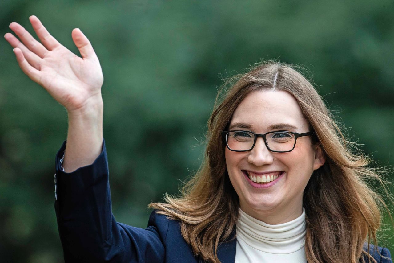 Sarah McBride waves at neighbors outside her home in Wilmington, Delaware, on October 1. 