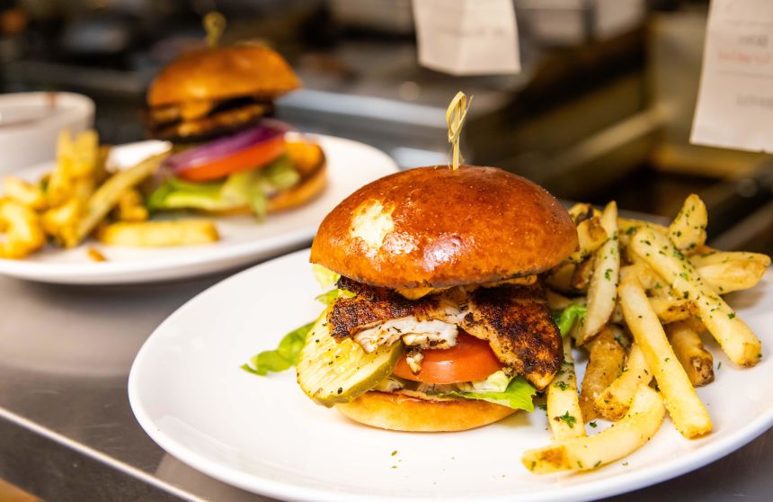 Grouper sandwiches wait to be delivered to diners at the Live Fire Chefs Cafe in Ocala, Florida.