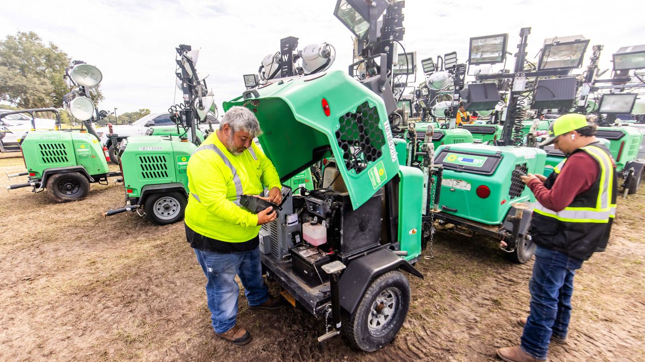 A Garner employee makes sure that a portable light is working as the logistics company stages equipment at the Florida Horse Park in Ocala, Florida, on Tuesday.