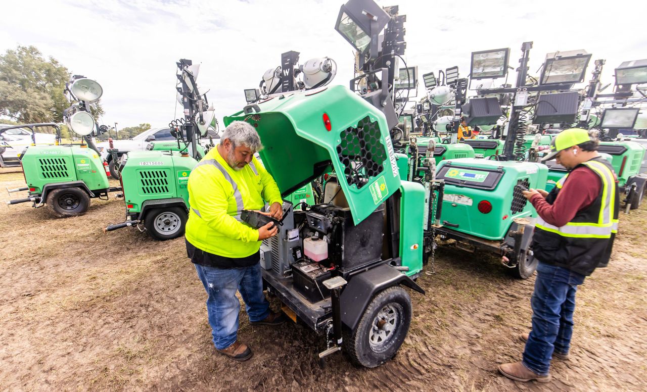 A Garner employee makes sure that a portable light is working as the logistics company stages equipment at the Florida Horse Park in Ocala, Florida, on Tuesday.