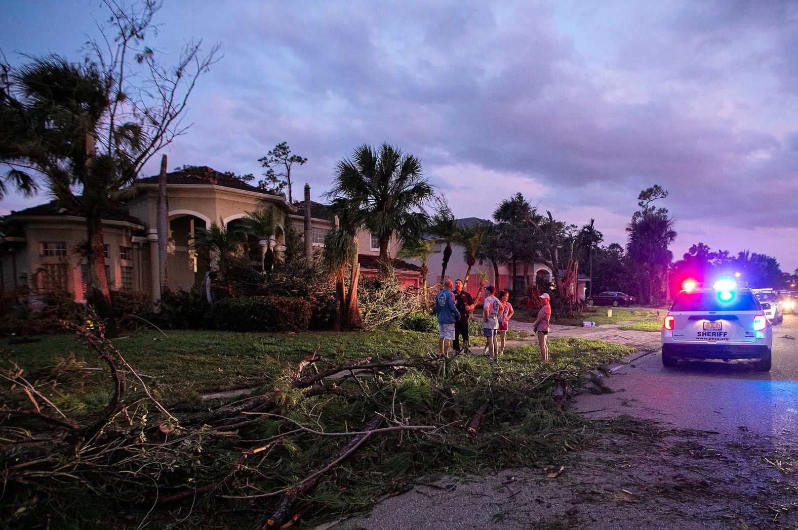 Palm Beach County Sheriff's deputies attend to residents affected by a reported tornado in Wellington on Wednesday.