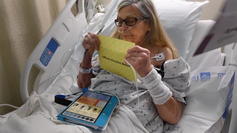 Alverta Kellaher seals the security envelope of her ballot at the WellSpan York Hospital in York, Pennsylvania, on Tuesday. The hospital provided a secure, emergency vote process for patients.