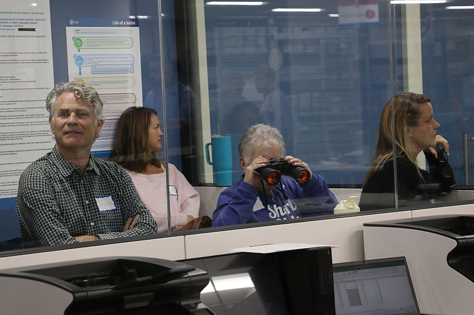 Election observers watch ballots being sorted and counted in Reno, Nevada, on Tuesday.