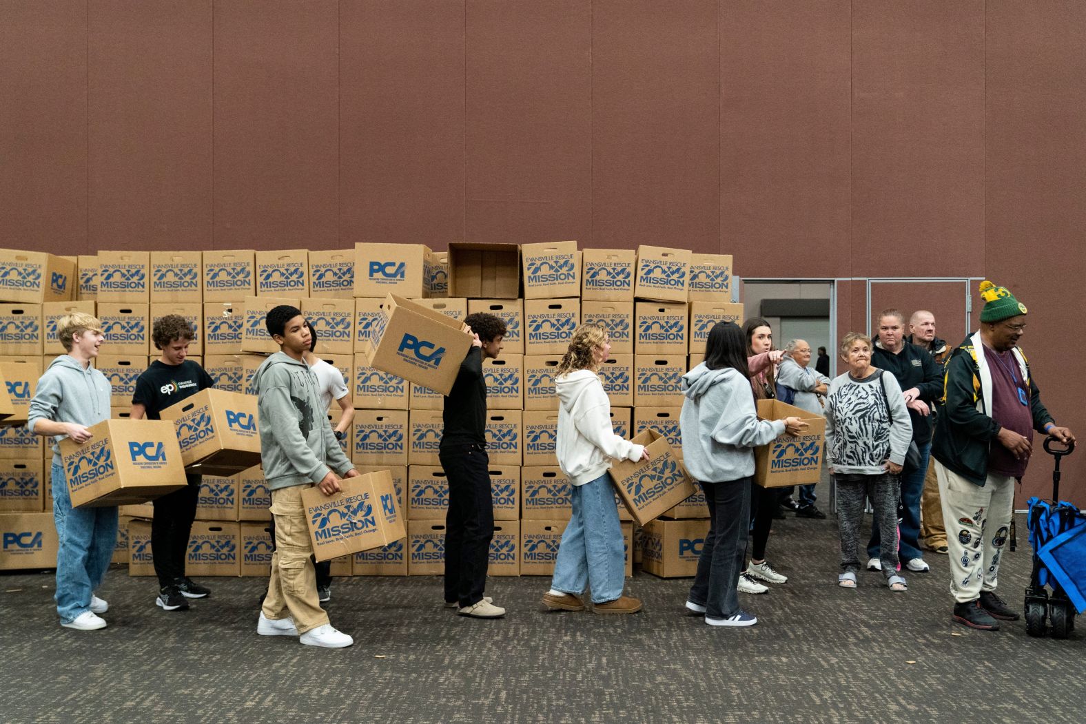 Volunteers in Evansville, Indiana, help fill Thanksgiving food boxes during the Evansville Rescue Mission's annual Gobbler Gathering on Tuesday.