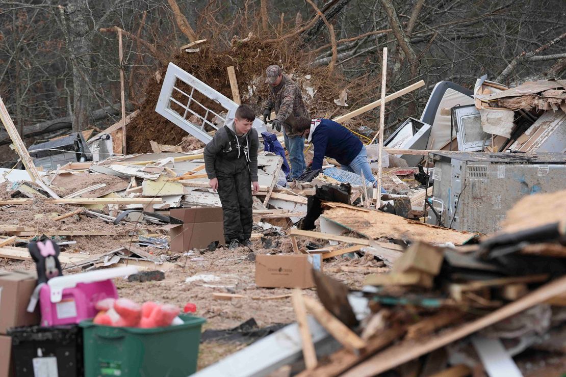 Residents assist in clean up off of Twin Bridge Road in Morgan County, Tennessee on February 7, 2025.