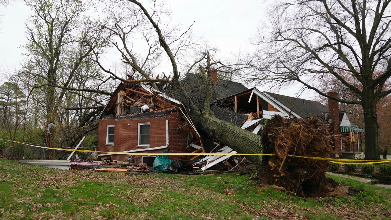 A tree uprooted by the storm crushed this home in the 100 block of Division Street in Erlanger, Kentucky.