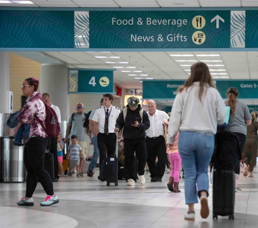 Passengers and flight crews at Pensacola International Airport in a file photo from April. The airport is one of the smaller airport seeing the impact of the Federal Aviation Administration's limitations of flights to and from the nation's 40 busiest airports.