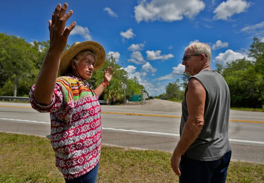 Betty Osceola, a Miccosukee tribe member, and Brad Keehn, from Ochopee, discuss the potential impact to the local ecosystem as a result of the incoming development of a new migrant detention center.