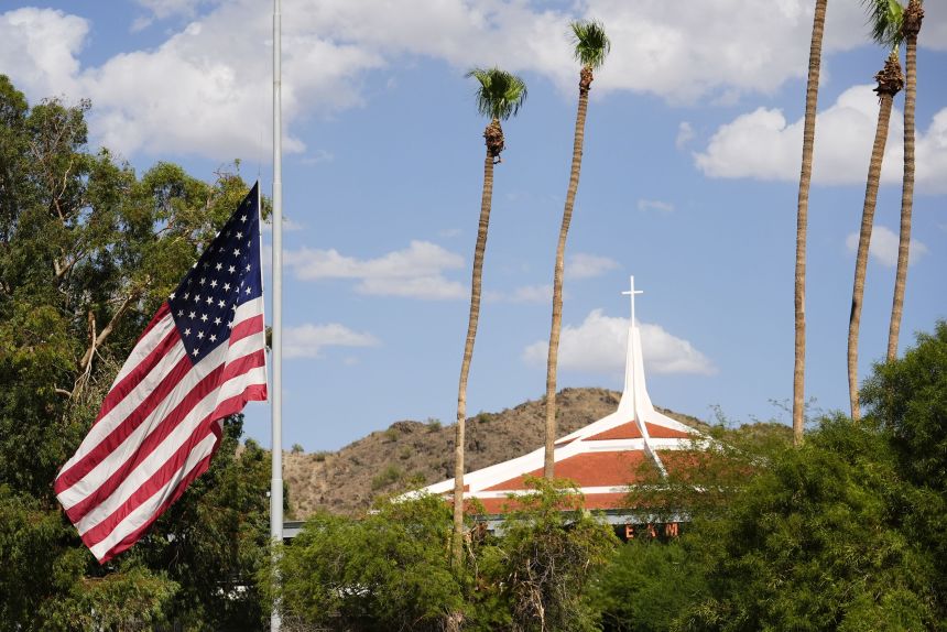 The American flag flies at half-staff in honor of Charlie Kirk at Dream City Church in Phoenix on September 10.