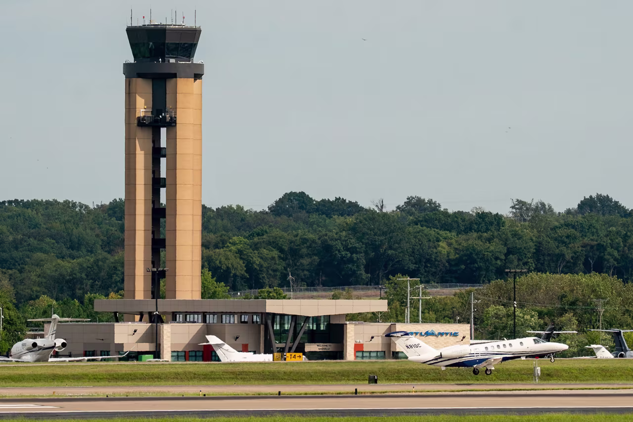 A jet takes off past the air traffic control tower at Nashville International Airport in Nashville, Tennessee, on  September 23.