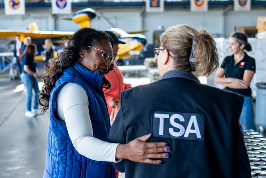 Ohio Rep. Emilia Sykes consoles Nicole Jones, a TSA employee of 10 years, at the Akron-Canton Airport during a special food pantry for federal employees amid the shutdown, October 20, 2025.