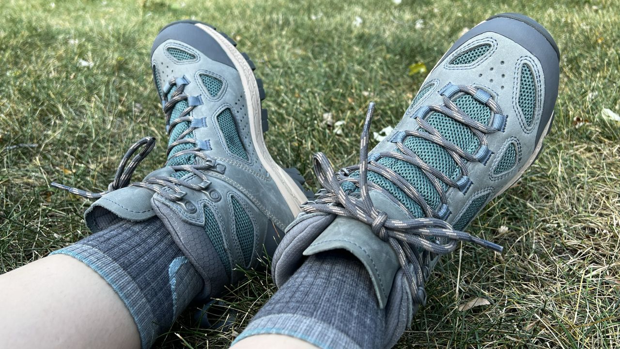 A seated hiker wearing their favorite hiking boots.