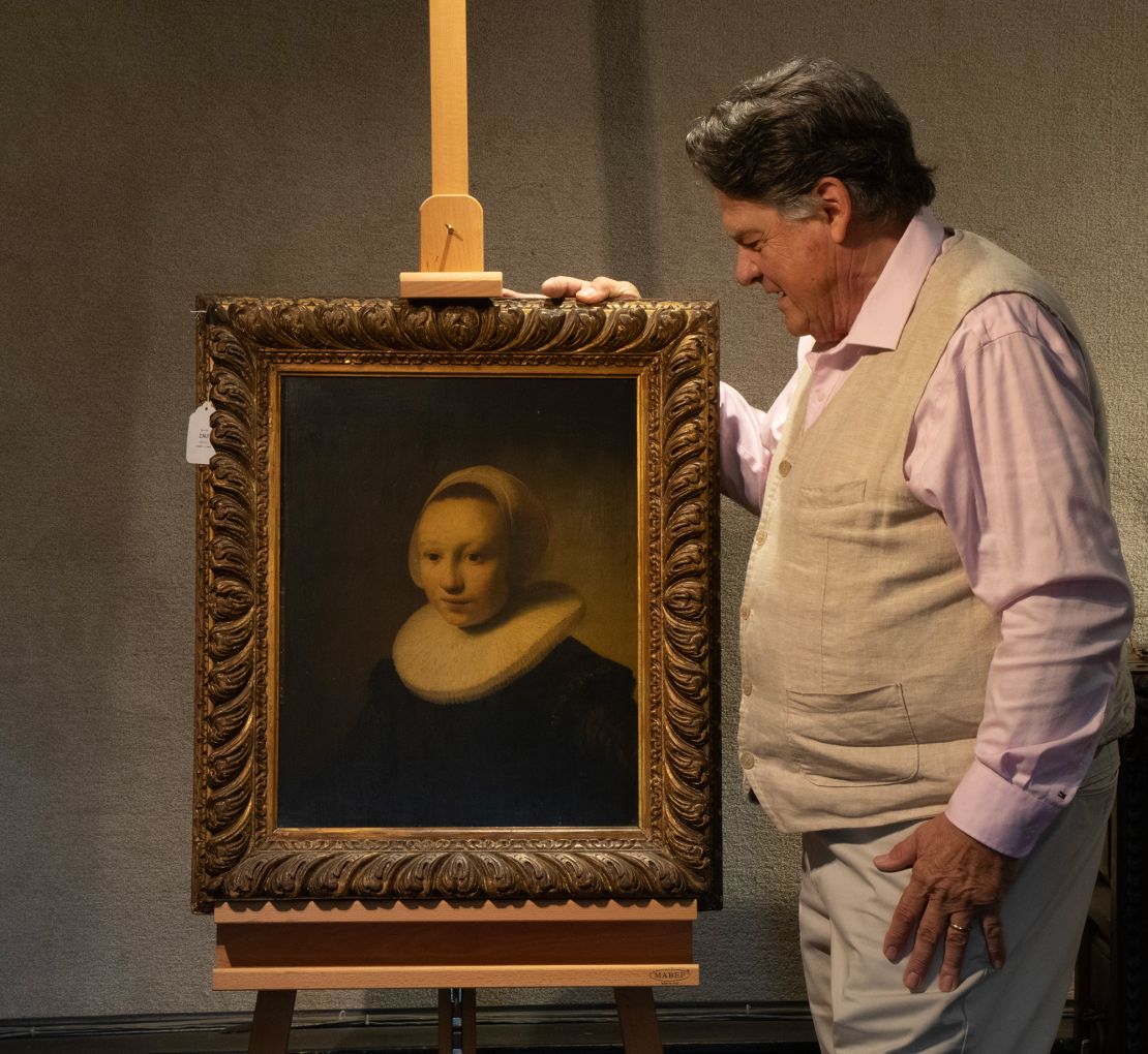 Auctioneer Kaja Veilleux pictured with the 17th-century portrait, which he discovered during a routine house call to a private estate in Camden, Maine.