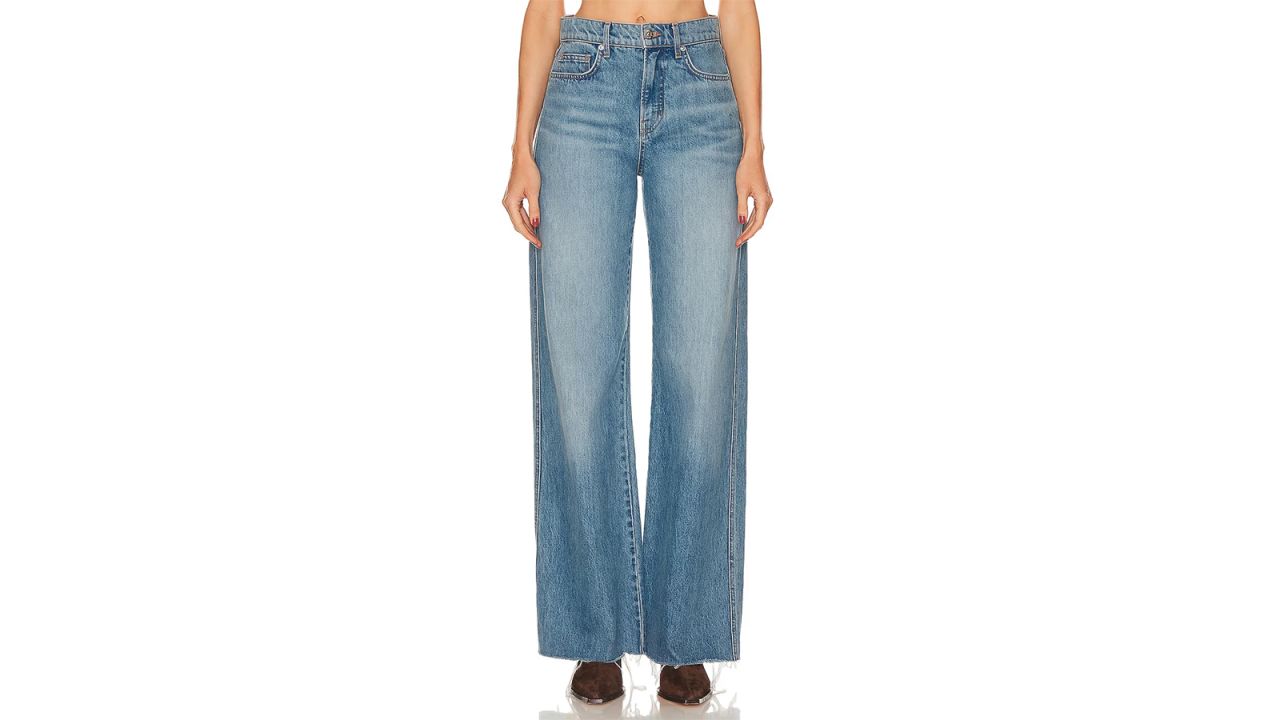 A person wearing Veronica Beard Taylor High Rise Wide Leg Jeans.