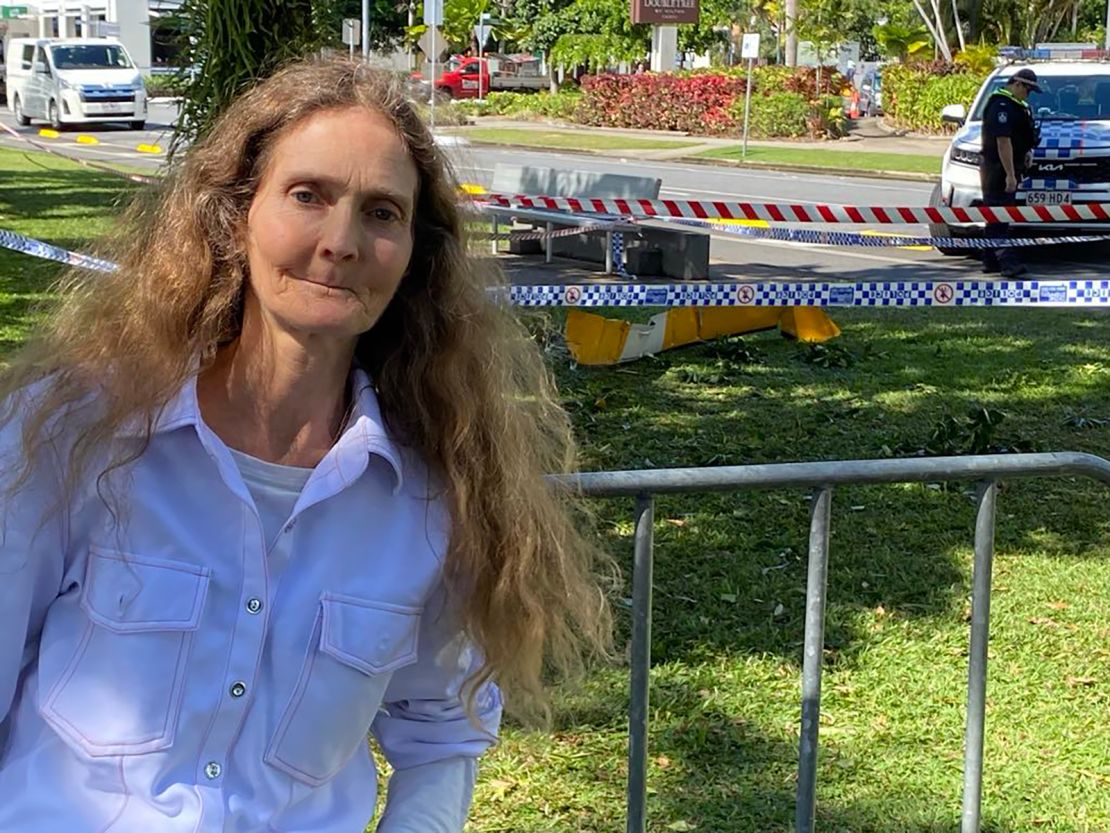 Witness Veronica Knight stands next to one of the rotors of the helicopter that landed a short distance from the hotel.