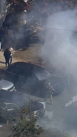 Protesters and officials face off in Chicago at scene of apparent crash