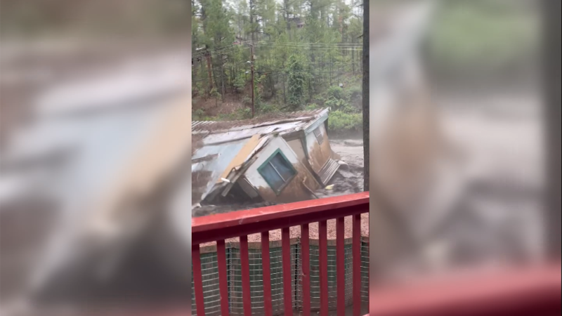 Trailer Swept Away By Raging Floodwaters | CNN
