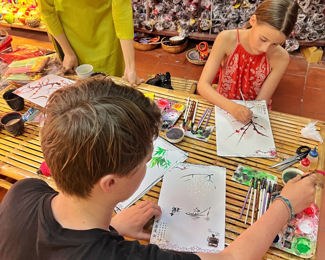 The kids tap into their creativity in Hoi An, Vietnam.