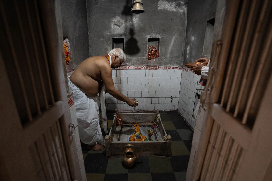 Vishwambhar Nath Mishra prays inside his temple in Varanasi.