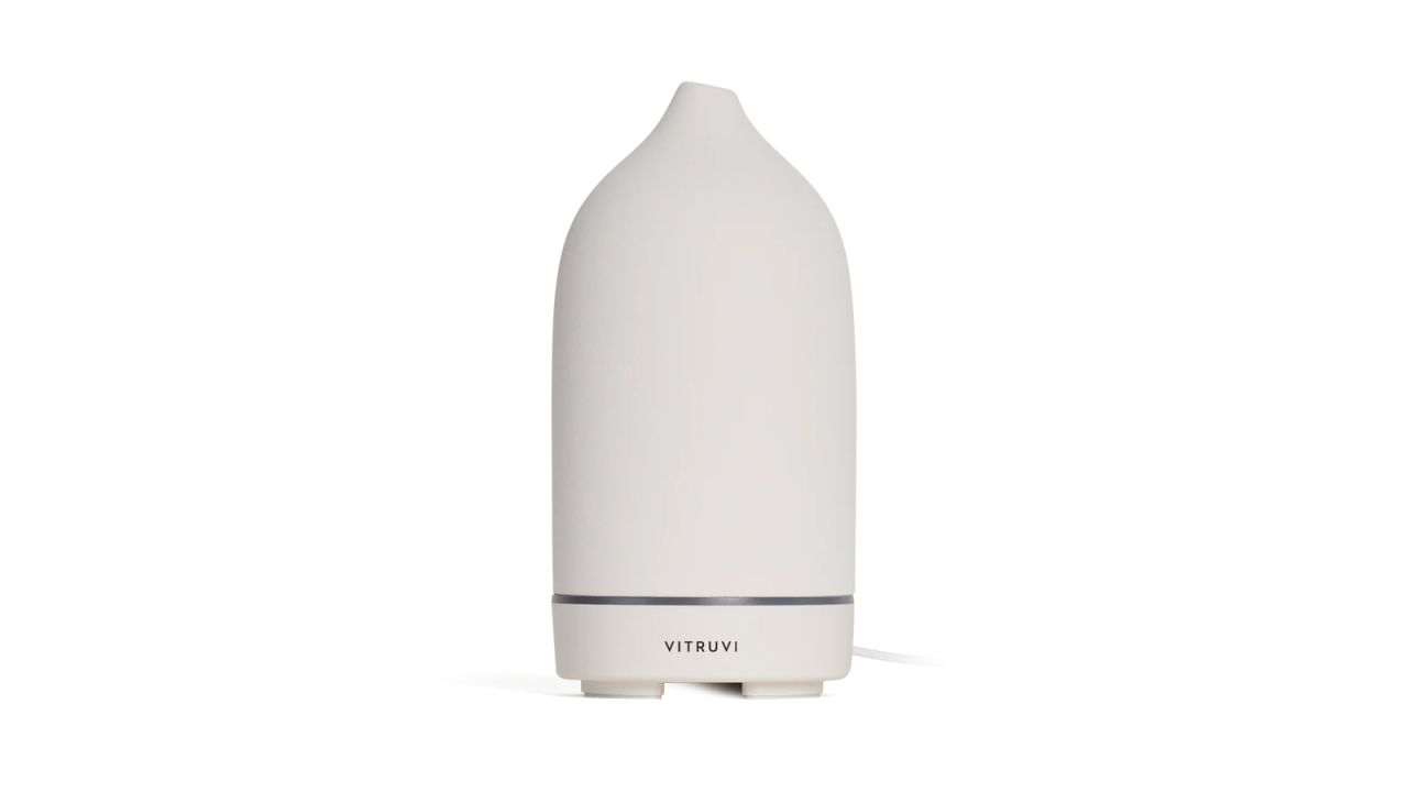 A white oil diffuser on a white background.