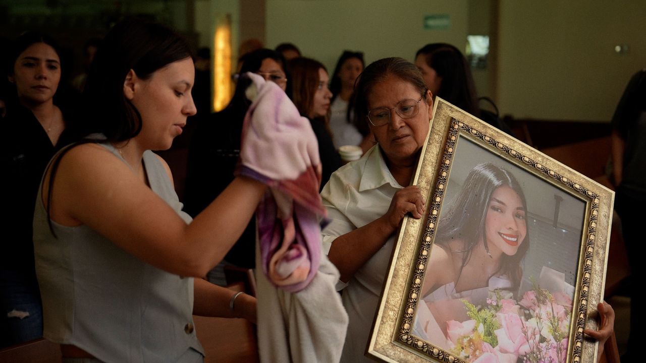 Vivian Aispuro's mother, Rosalinda Cabanillas, and her sister, Alma, are seen at Vivian's funeral.