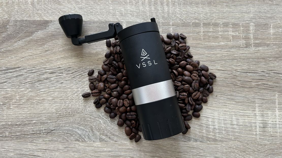 vssl java g25 coffee grinder on a bed of coffee beans