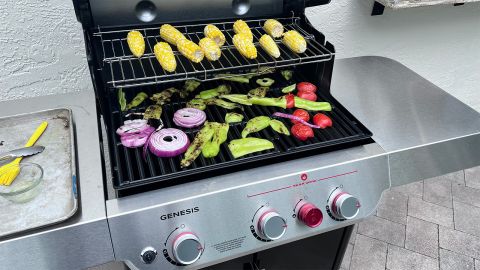 Corn, peppers, tomato and onion grilling on a Weber Genesis propane grill