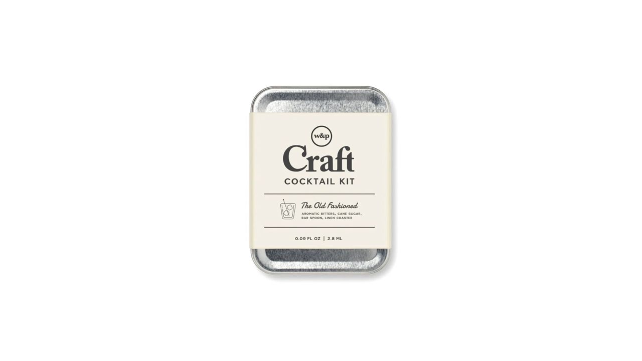 A photo of the W&P DIY Craft Cocktail Kit in a metal tin