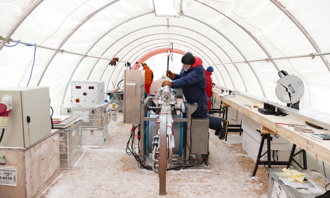 Inside the drilling tent at Skytrain Ice Rise, scientists preparing the drill for its next drop into the borehole.