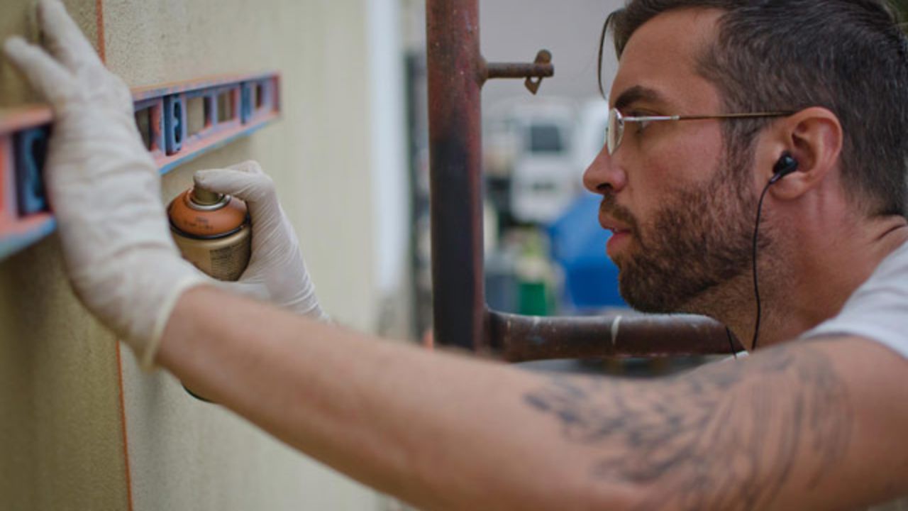Ferrari is a painter specializing in murals and fine art. Here he is works on a new piece. - (Courtesy Peter Ferrari)