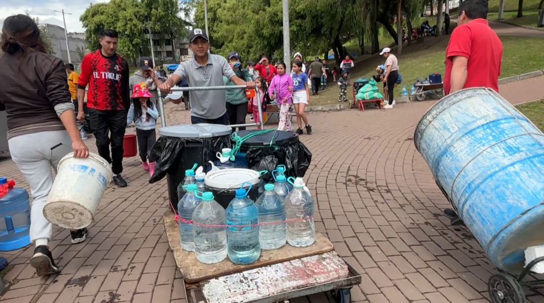 People in Quito, Ecuador, transport water gathered from a nearby spring.
