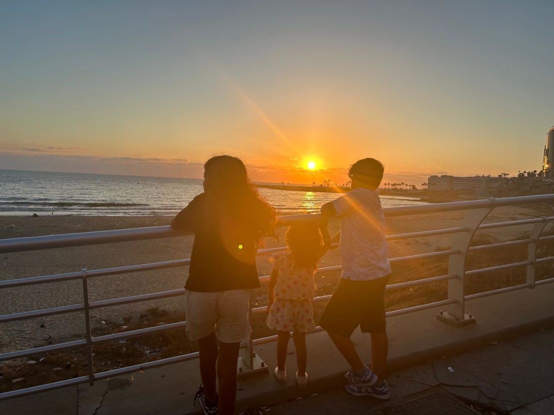 Katya and her cousins, age 9 and 11, watch the sunset in Beirut on Tuesday, July 30. Moments later, the Israeli military carried out a “targeted strike” in southern Beirut, roughly 10 minutes’ drive away.