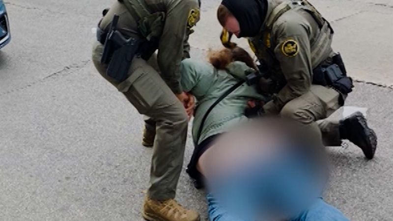 Federal agents detain a Chicago TV station employee