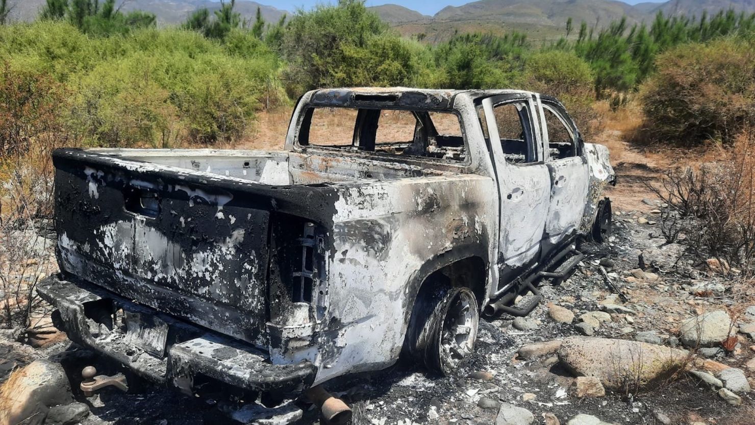 A burned-out white pickup truck discovered at a ranch in Santo Tomas is the same car that the two Australians and an American man were driving before they went missing, according to a local police source.