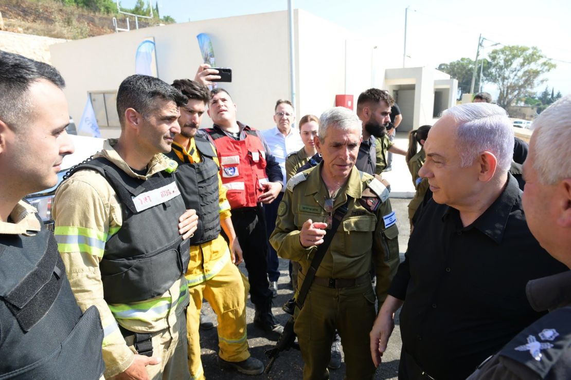 Israeli Prime Minister Benjamin Netanyahu visits Kiryat Shmona, a northern city near the Lebanese border, after large fires erupted in the area following rocket fire from southern Lebanon, on Wednesday.
