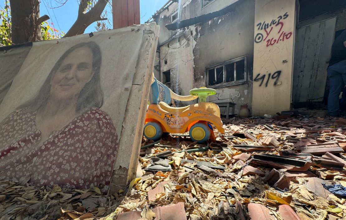 ?A child's ride-on toy is seen surrounded by rubble in kibbutz Be'eri, nearly a year after the Hamas-led October 7 attack.