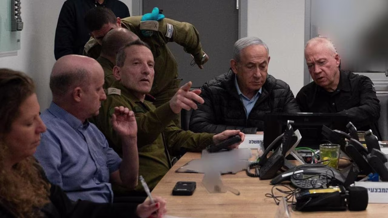 Israeli Prime Minister Benjamin Netanyahu and Defense Minister Yoav Gallant monitor the attack on Iran from an undisclosed location. Parts of the image were obscured by the Israel Defense Forces.