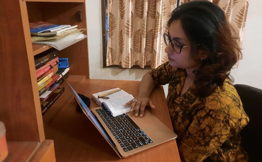 Meghamala Ghosh working on her laptop at home.