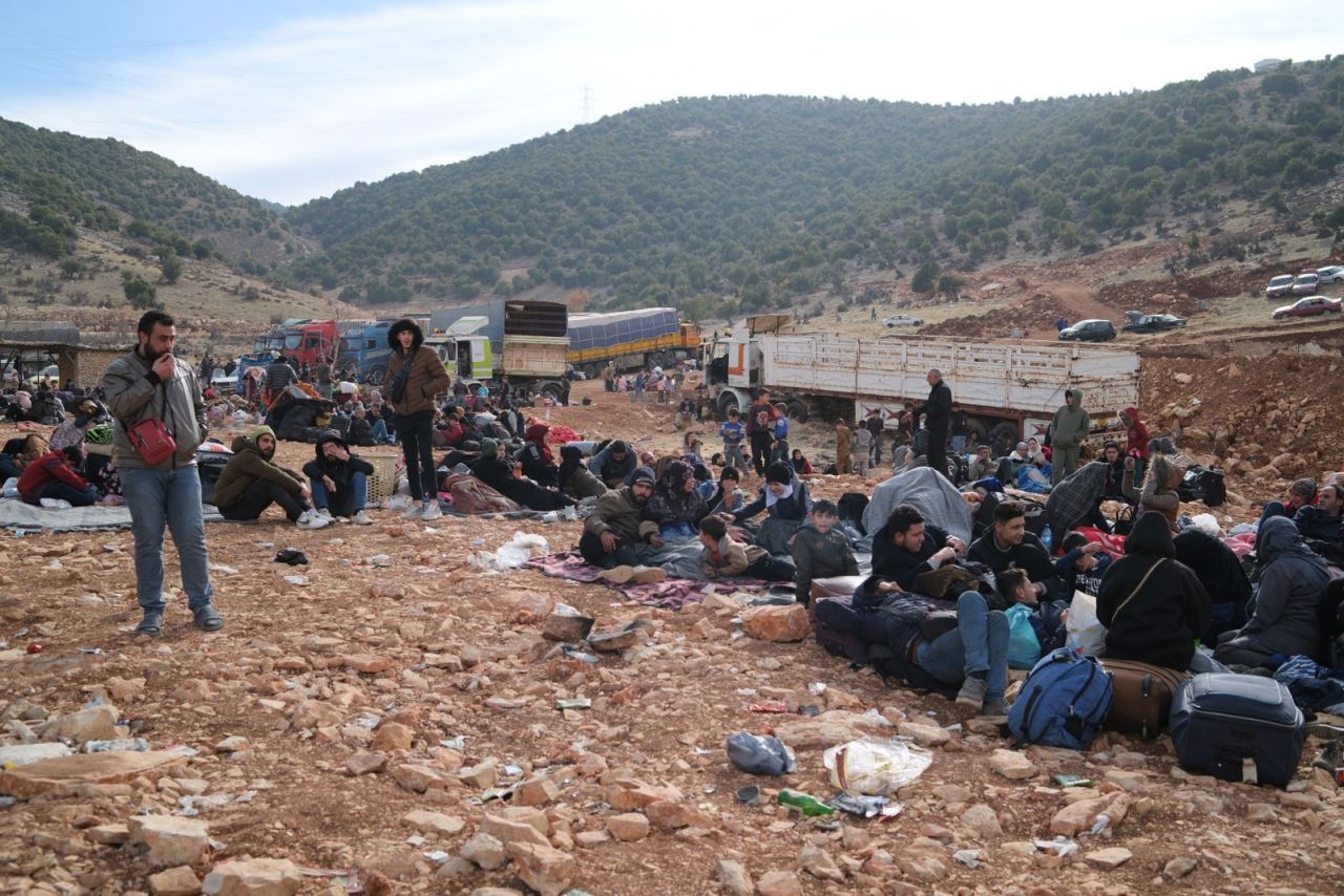 Just beyond the Masnaa border crossing, in the no man’s land between Lebanon and Syria, thousands of people were waiting on Thursday to get permits to enter Lebanon.