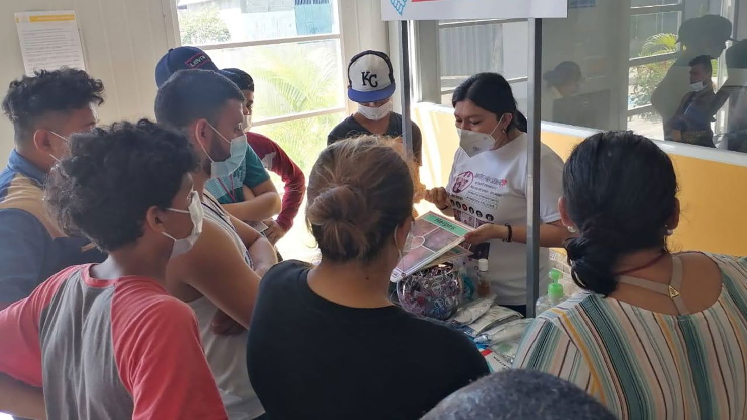 People receive information about sexual and reproductive health from A Helping Hand in the Fight Against AIDS (UMALCS).