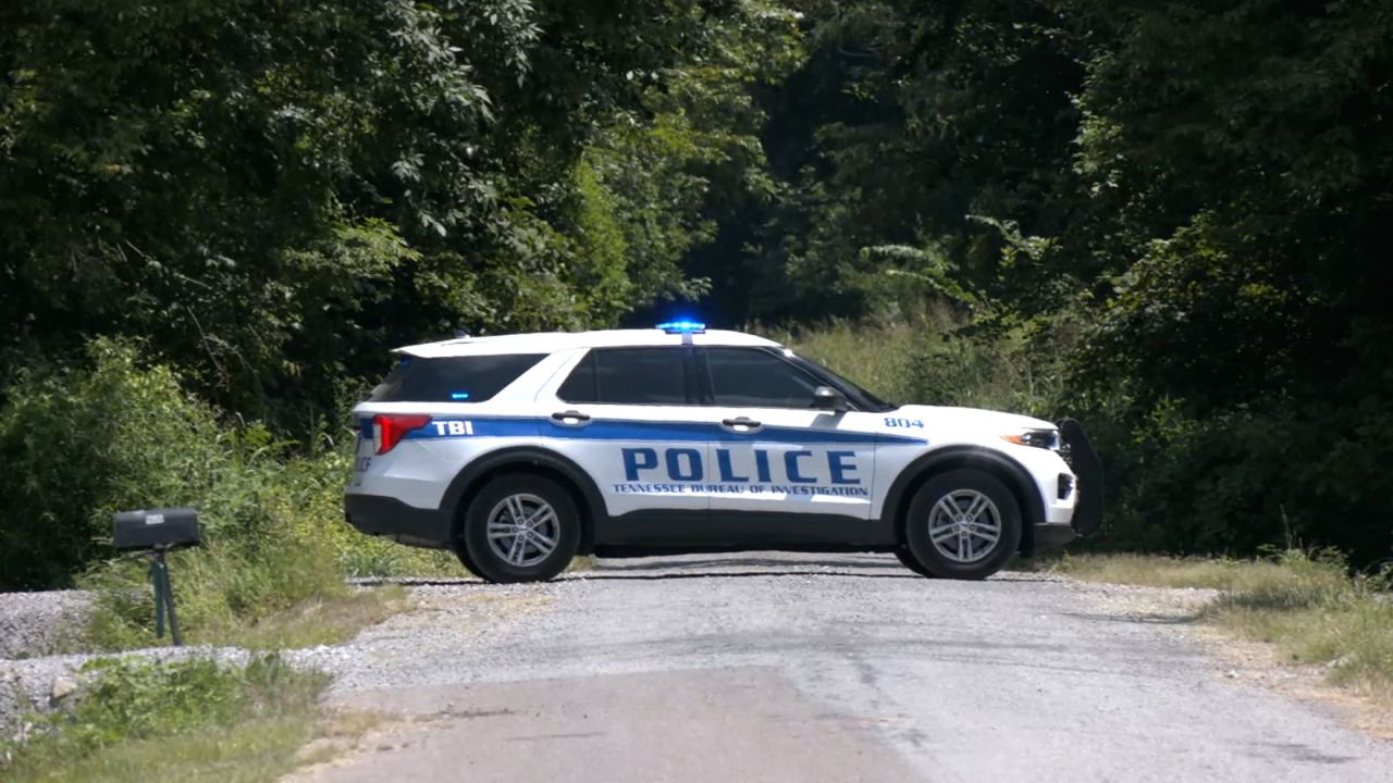 A police vehicle parks in Lake County, Tennessee, where the bodies were found