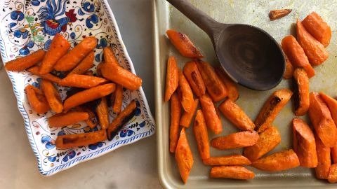 The Williams-Sonoma Goldtouch Pro Nonstick Half Baking Sheet, with roast carrots and a serving dish