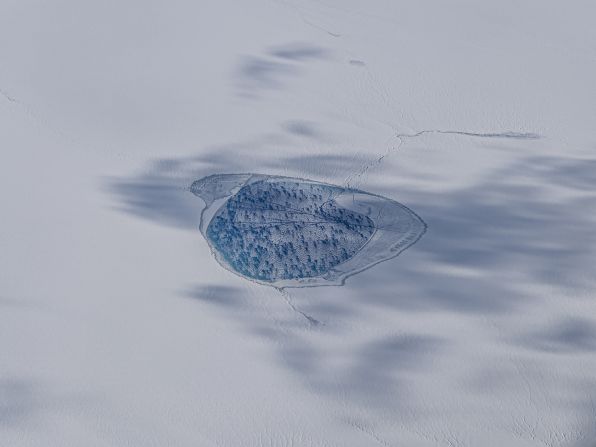 A supraglacial melting lake over the Greenlandic ice sheet was captured by David Garcia using an iPhone 15 pro during a flight. "Ice cap melt lake" was the winner in the Earth science category.