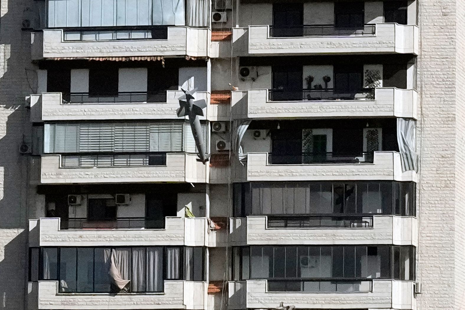 A bomb launched from an Israeli jet barrels toward a building in Beirut on Tuesday, October 22. Two multistory buildings in the Ghobeiry neighborhood <a href="index.php?page=&url=https%3A%2F%2Fwww.cnn.com%2Fworld%2Flive-news%2Fisrael-iran-lebanon-gaza-war-10-22-24-intl-hnk%23cm2kmnnh600003b6oskv4evso">were flattened in a missile strike Tuesday</a>, according to CNN analysis of video captured at the scene. Just 30 minutes before, the Israel Defense Forces’ Arabic spokesperson Avichay Adraee issued an evacuation order for the buildings on social media, saying they were located “near facilities and interests belonging to Hezbollah.” Associated Press photographer <a href="index.php?page=&url=https%3A%2F%2Fapnews.com%2Farticle%2Flebanon-beirut-israel-missile-41be424dcf3031457bd93acd0cb3389e" target="_blank">Bilal Hussein</a>, who took this photo, said he “heard the sound of the missile whistling, headed toward the building.”