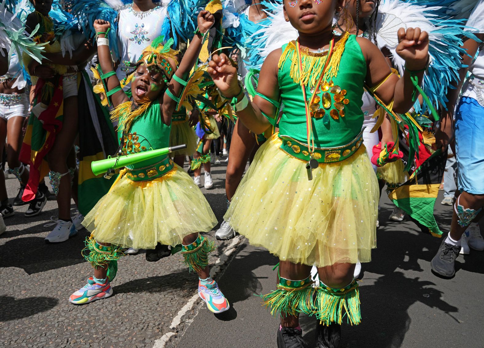 People take part in the Children's Day Parade that was part of the Notting Hill Carnival celebration in London on Sunday, August 25.