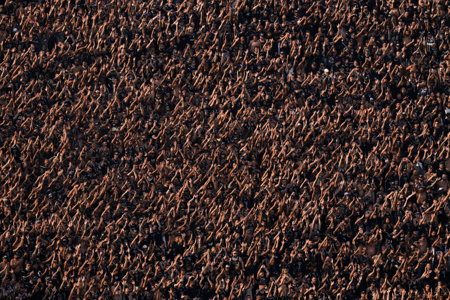 Fans cheer in the stands of Corinthians Arena during a Brazilian soccer league match between Corinthians and Flamengo in S?o Paulo, Brazil, on Sunday, September 1.