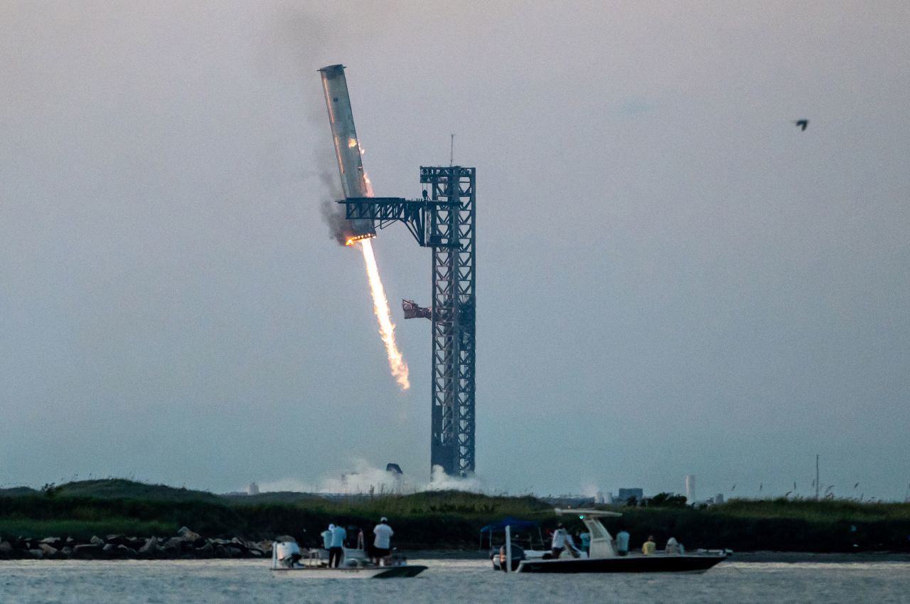 SpaceX Starship's Super Heavy booster successfully returns to the launch pad on October 13, 2024.