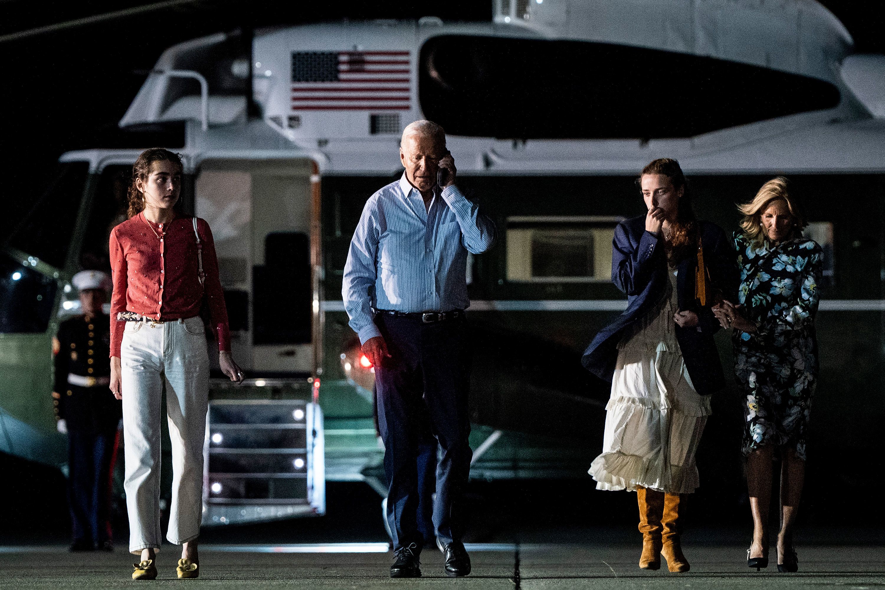 US President Joe Biden talks on the phone as he heads to Camp David with his family on Saturday, June 29.