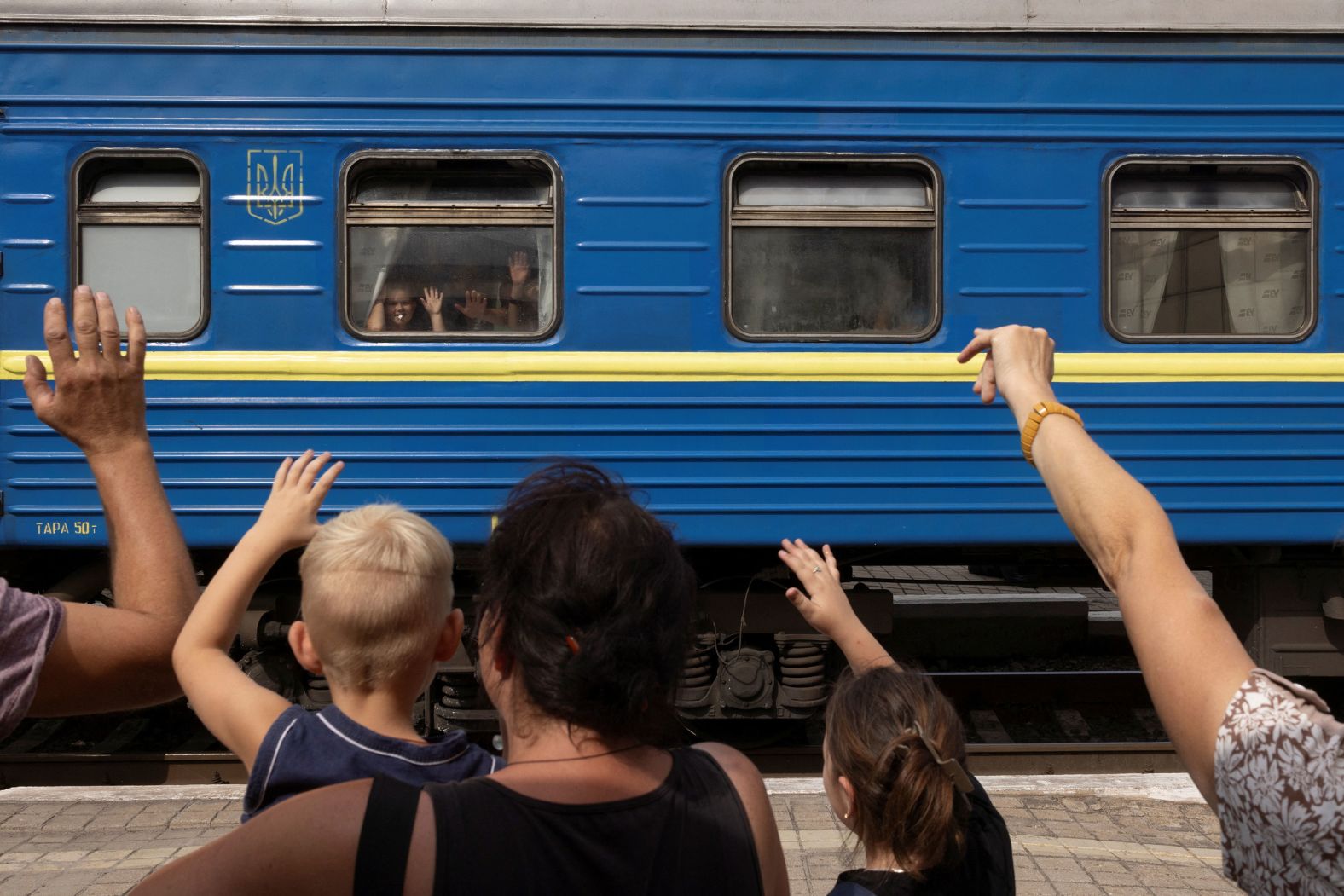 Evacuees wave goodbye to relatives as they flee Pokrovsk, Ukraine, on Thursday, August 22. Russian forces have been pushing hard <a >to capture Pokrovsk</a>, a strategic target for Moscow.